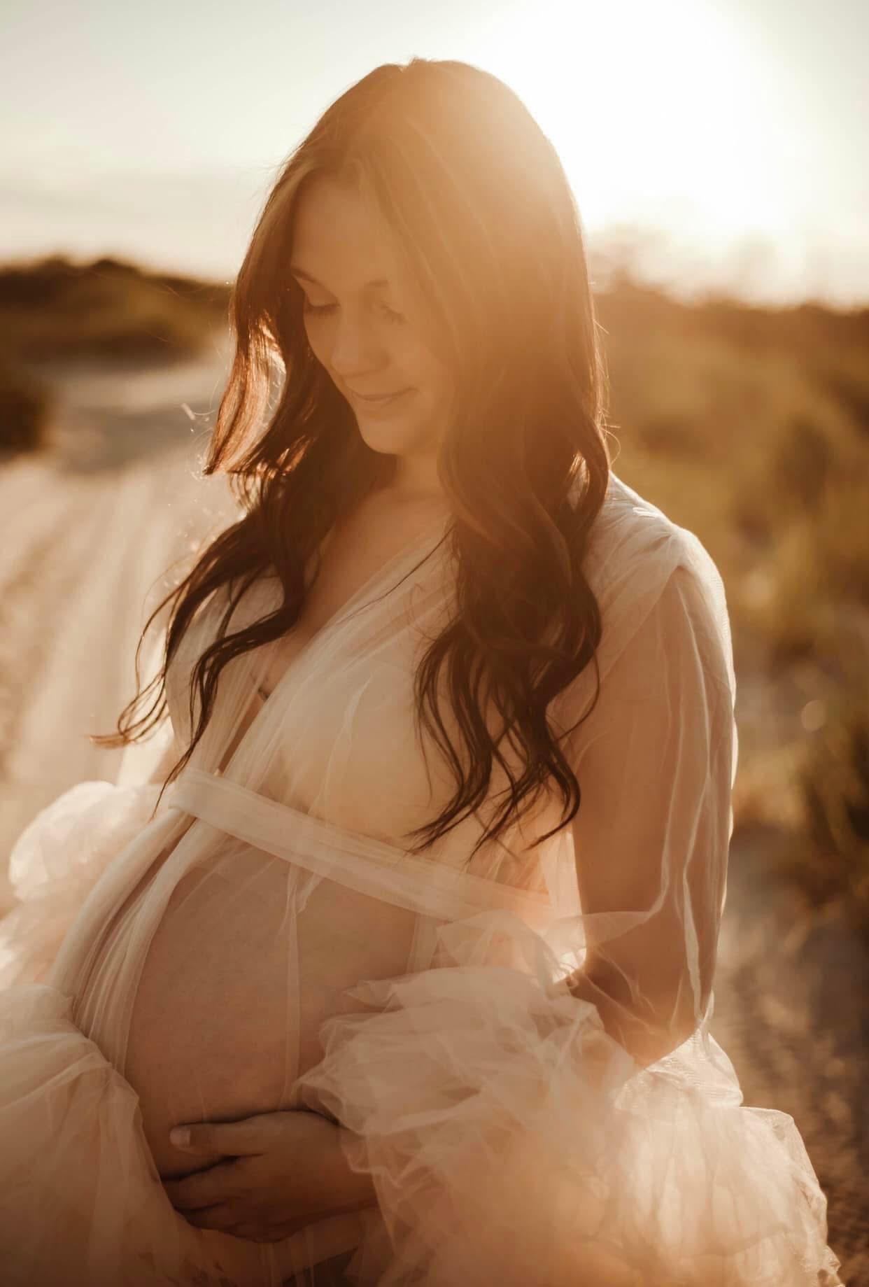 Sunlit maternity portrait